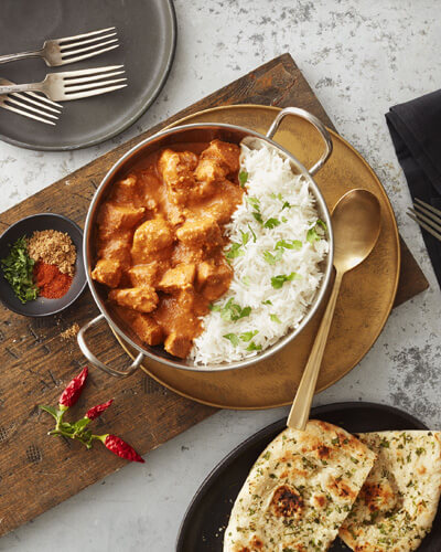 pot of butter chicken and rice