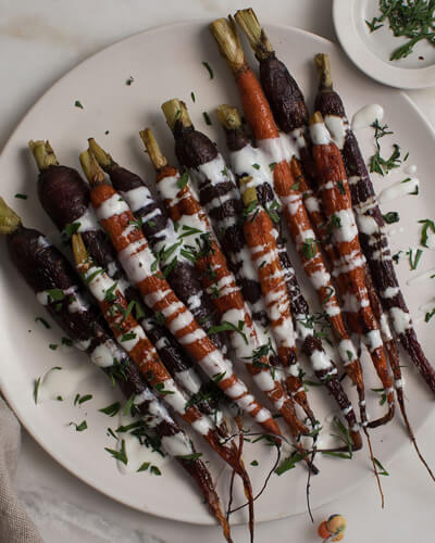 plate of roasted carrots with lemon yoghurt drizzle