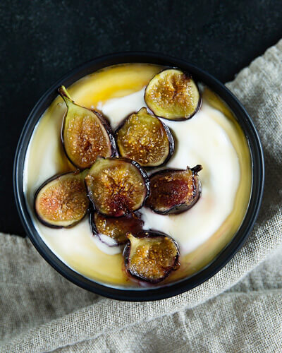 bowl of roasted figs with yoghurt and honey