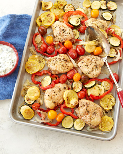 Sheet-Pan Chicken Ratatouille with Herbed Yoghurt and Feta Sauce In a sheet pan, chicken thighs are baked with herbs, squash, zucchini, peppers, and tomatoes. As an accompanying dipping sauce, there is an herbed yoghurt and feta sauce made with made with Mountain High
