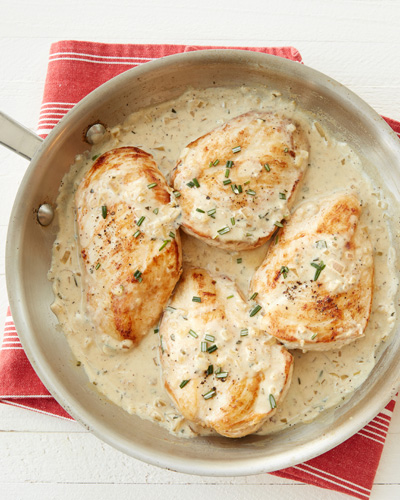 Skillet Rosemary Dijon Chicken in Creamy Yoghurt Sauce In a skillet, there are chicken breasts, cooked with Mountain High Original Whole Milk Plain Yoghurt, rosemary, honey, dijon mustard, garlic, shallot, white wine, and butter.